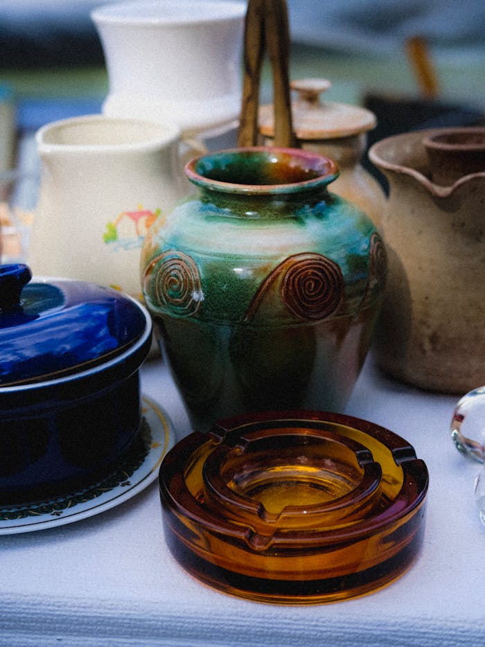 Colorful earthenware and ceramic jars captured in a detailed still life photo.